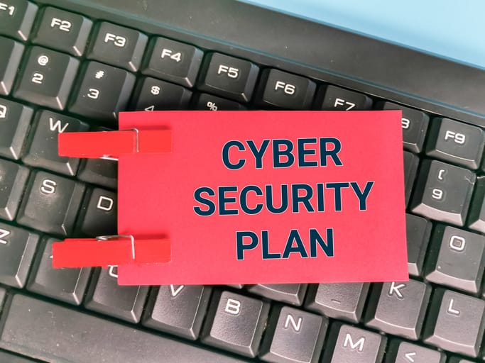 A Red cybersecurity plan, likely a WISP sitting on a black keyboard.